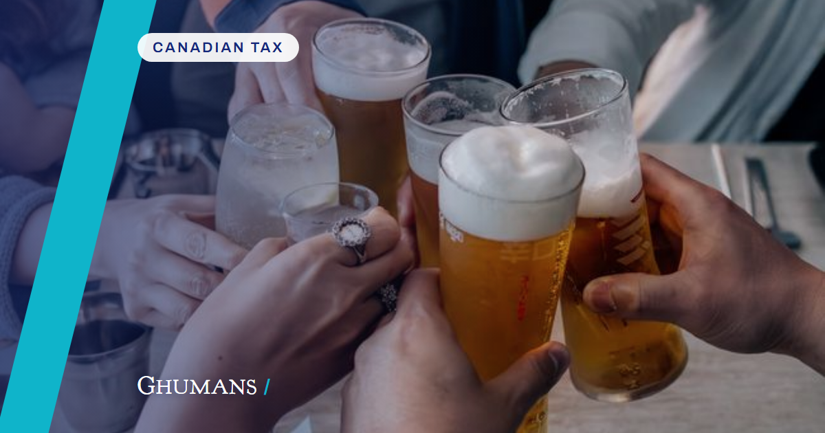 Close-up of friends toasting with assorted drinks at a gathering, capturing a moment of celebration and camaraderie.