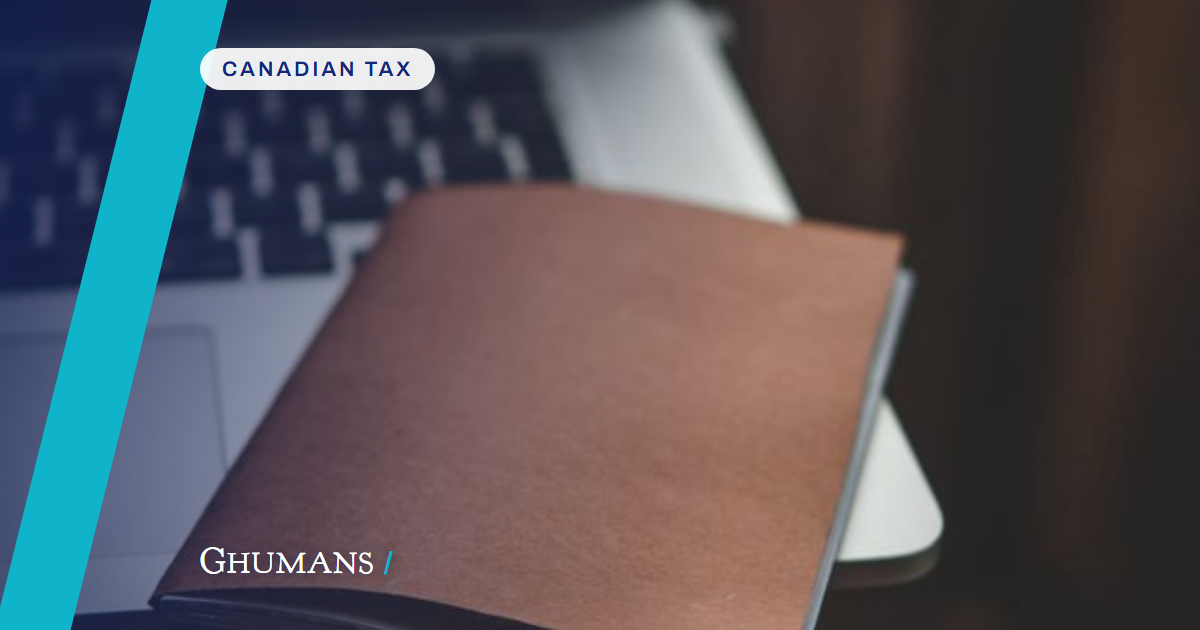 A brown notebook placed on a laptop in a cozy indoor setting, perfect for productivity.